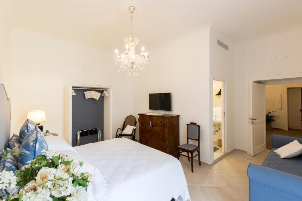 Posteľ alebo postele v izbe v ubytovaní Palazzo Cacace Relais