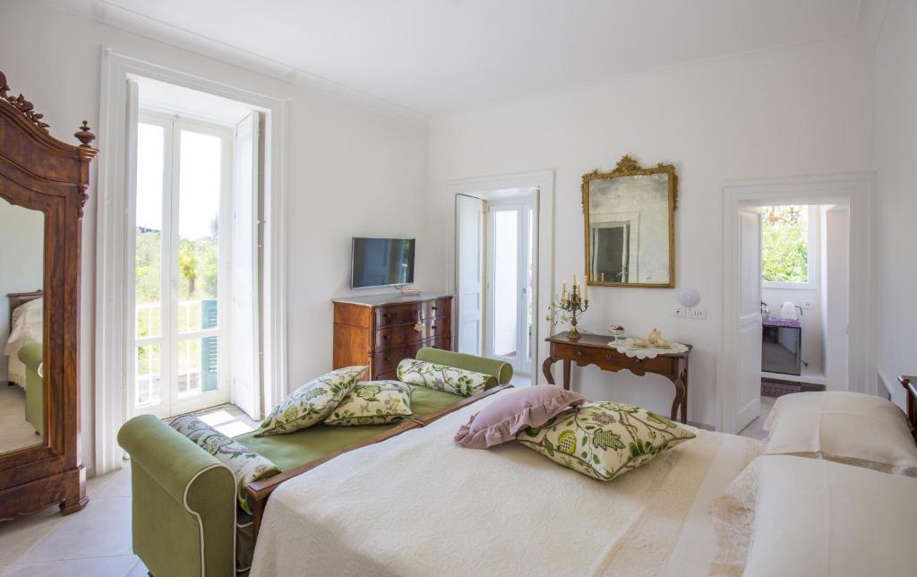 Posteľ alebo postele v izbe v ubytovaní Palazzo Cacace Relais