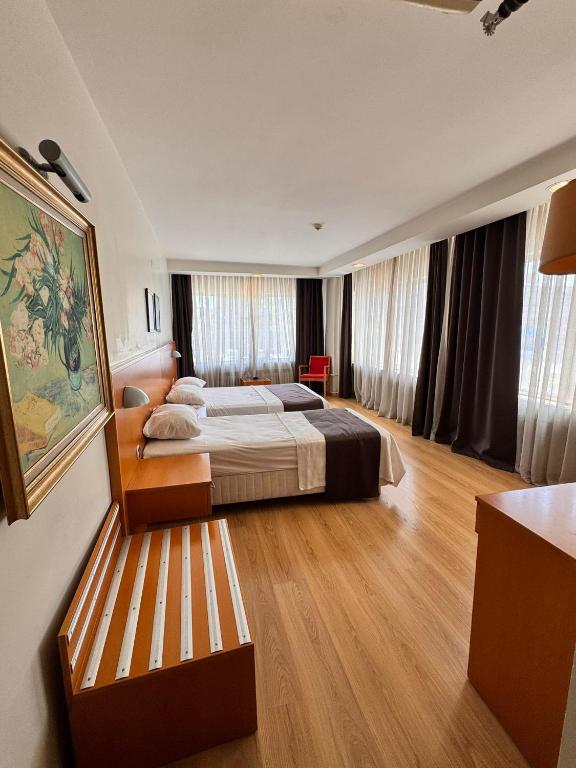 Postel nebo postele na pokoji v ubytování SİMİSSO HOTEL