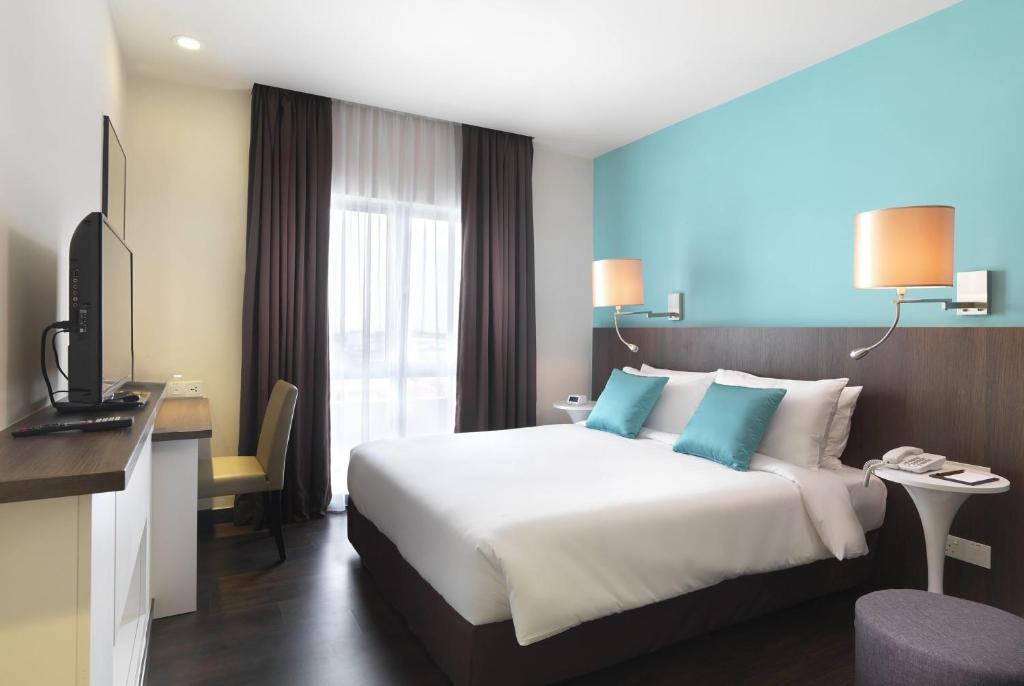 Postel nebo postele na pokoji v ubytování Wyndham Garden i-City Shah Alam