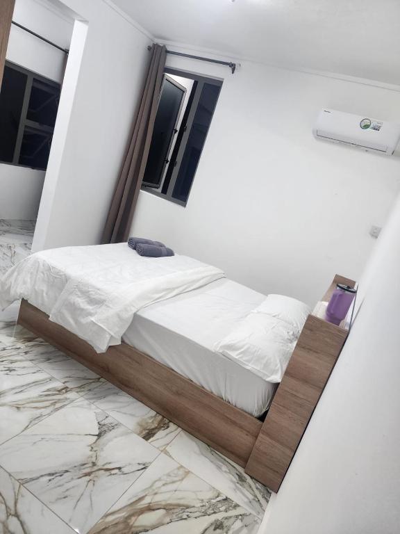 Postel nebo postele na pokoji v ubytování Snz Guesthouse