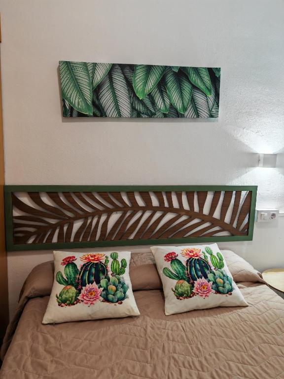 Postel nebo postele na pokoji v ubytování Hostal Noray