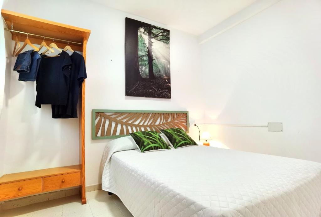 Postel nebo postele na pokoji v ubytování Hostal Noray