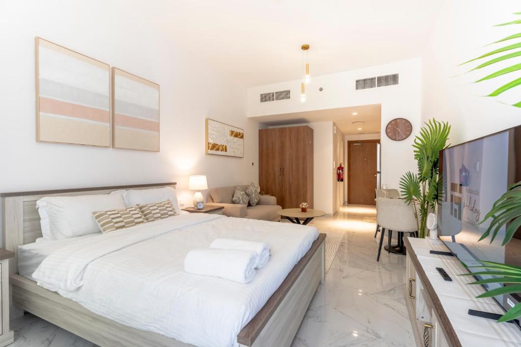 Ένα ή περισσότερα κρεβάτια σε δωμάτιο στο Stunning Oasis 1 Studio Masdar City