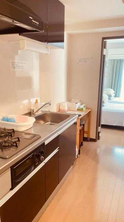 Kuchyň nebo kuchyňský kout v ubytování SkyHotel Ryogoku 駅徒歩4分