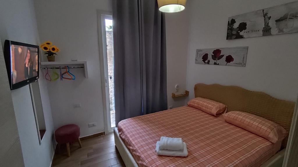A bed or beds in a room at Affittacamere Silvagni