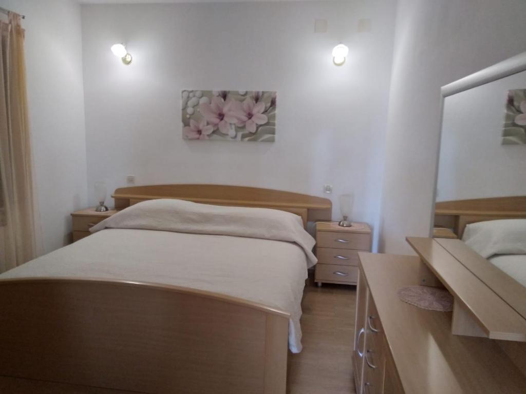 Ένα ή περισσότερα κρεβάτια σε δωμάτιο στο Apartman Maya