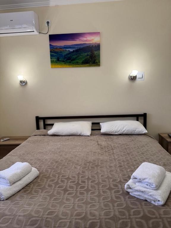 Postel nebo postele na pokoji v ubytování Hotel ELYSIUM