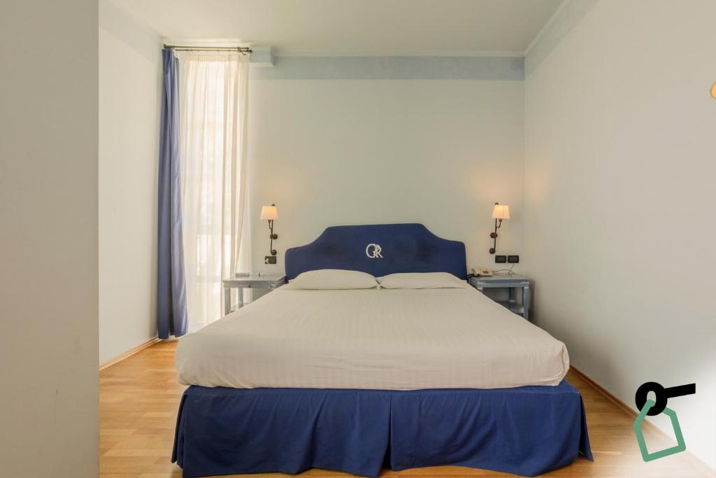 Postel nebo postele na pokoji v ubytování HOTIDAY Room Collection - Calambrone