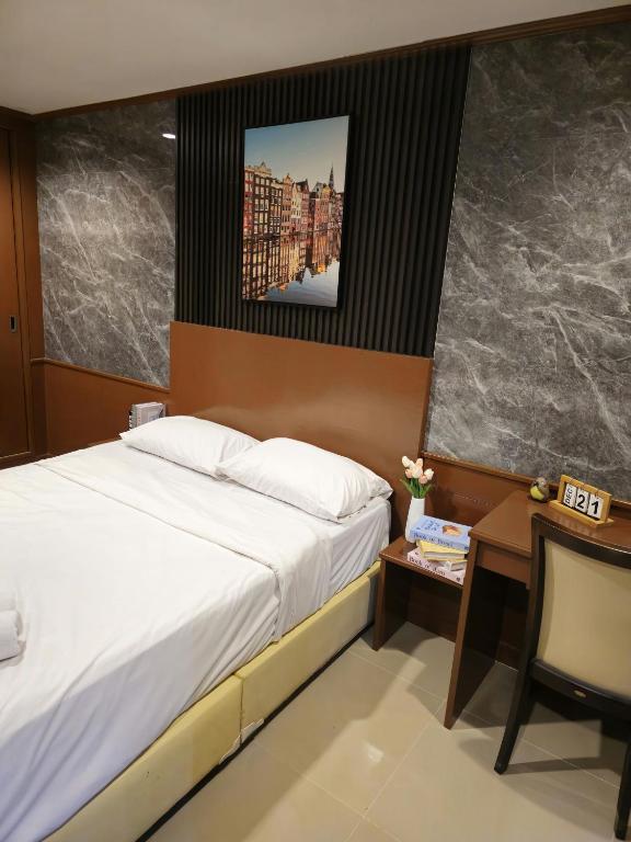 Postel nebo postele na pokoji v ubytování JHP Apartment
