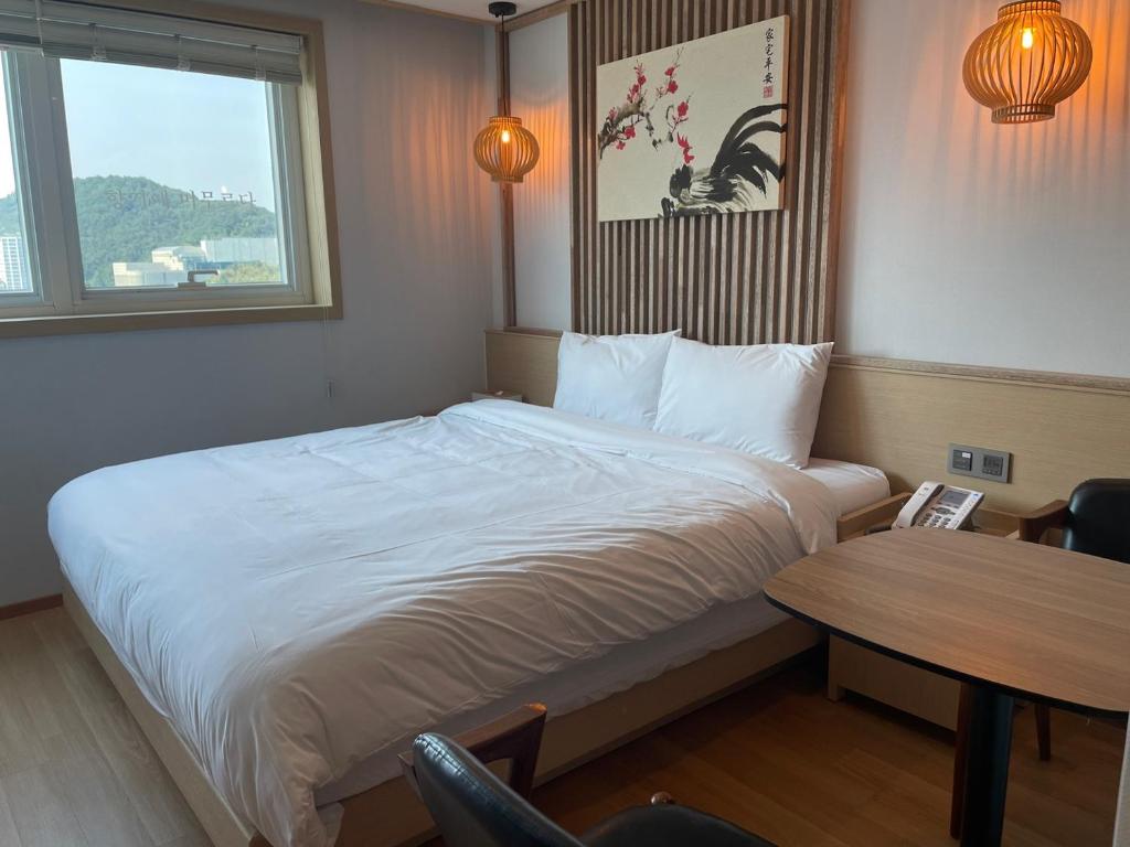 Postel nebo postele na pokoji v ubytování Hotel Badada