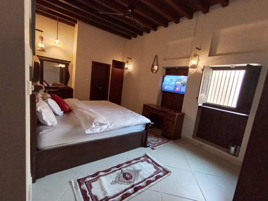 Postel nebo postele na pokoji v ubytování Hyba Heritage Guest House