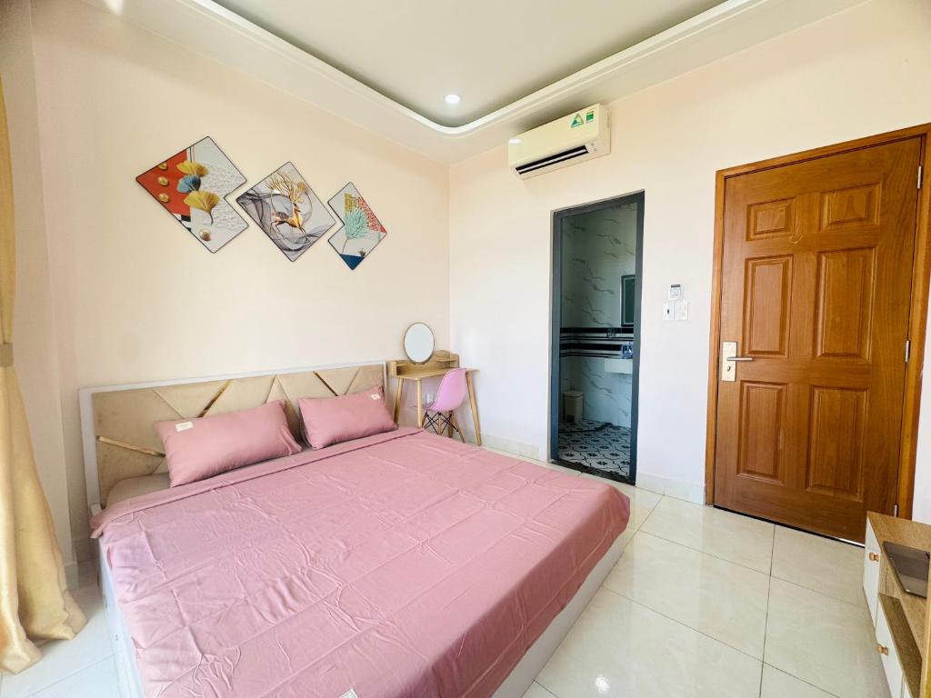 Postel nebo postele na pokoji v ubytování Mila Homestay Grand World Phú Quốc