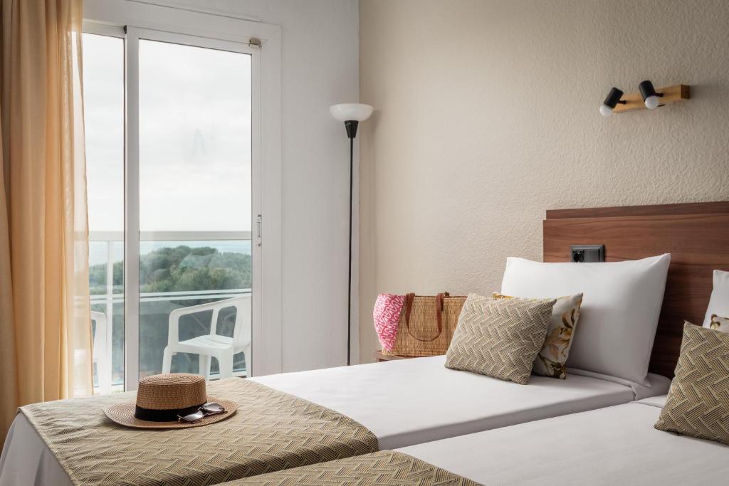 Postel nebo postele na pokoji v ubytování Hotel Cartago Nova by ALEGRIA