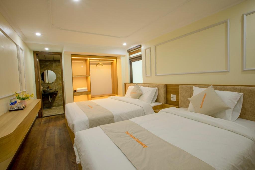 Postel nebo postele na pokoji v ubytování Tom Central Homestay