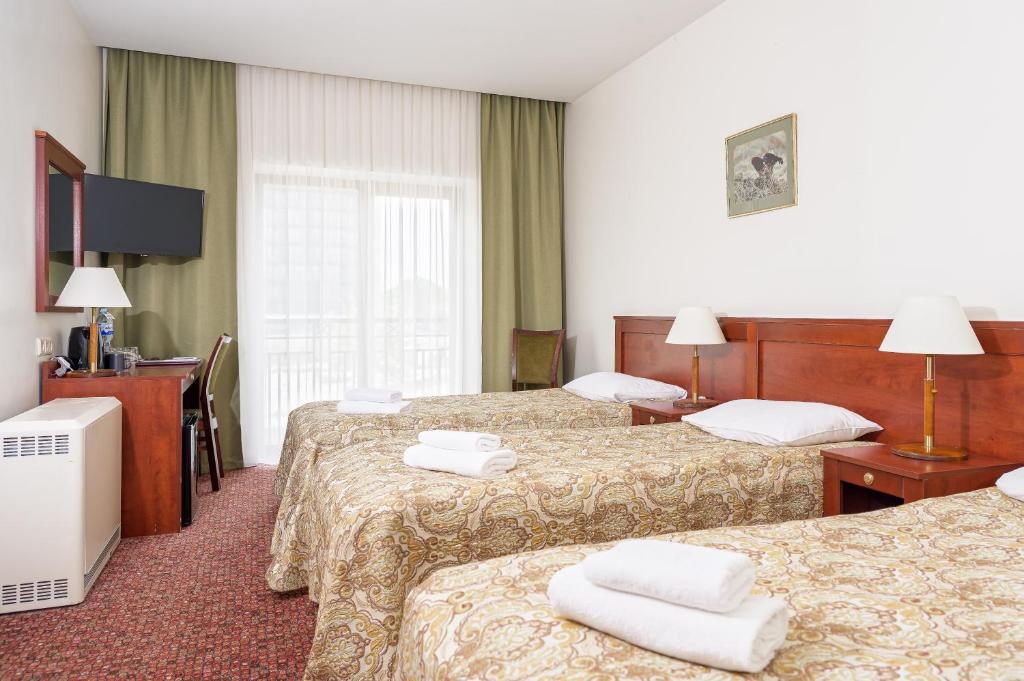 Postel nebo postele na pokoji v ubytování Regina