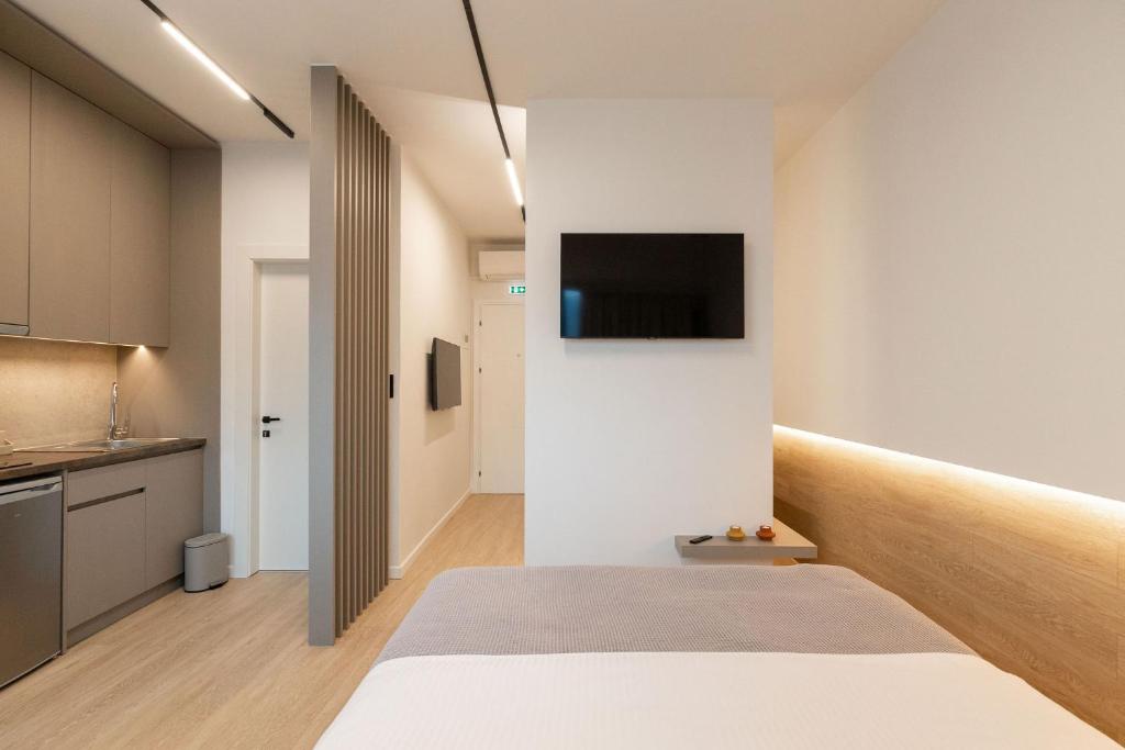Postel nebo postele na pokoji v ubytování Xanthia Suites