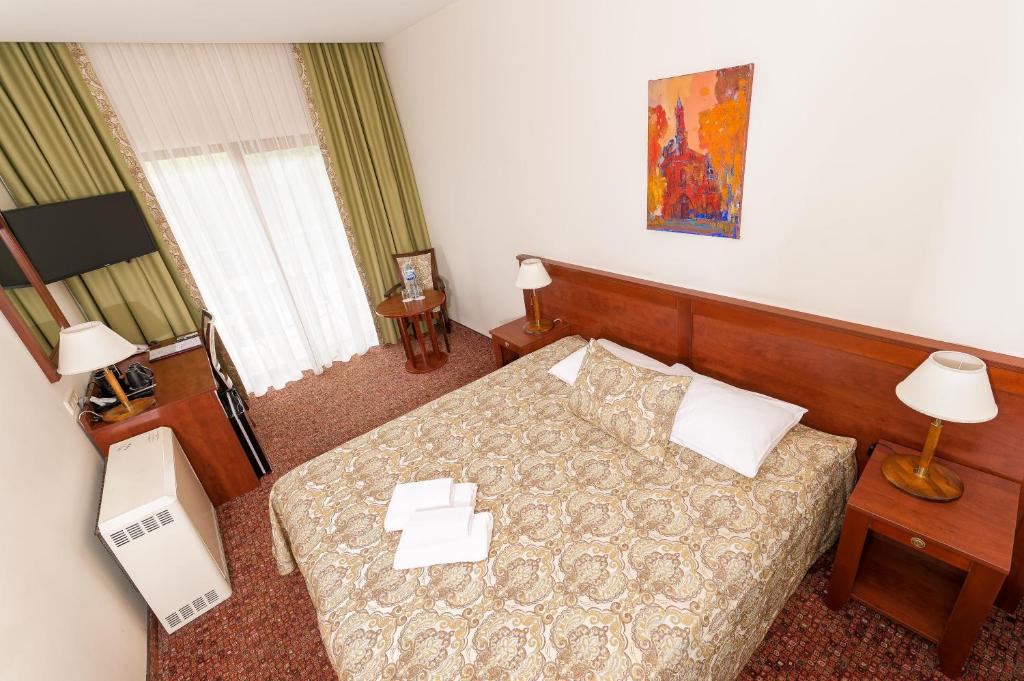Postel nebo postele na pokoji v ubytování Regina