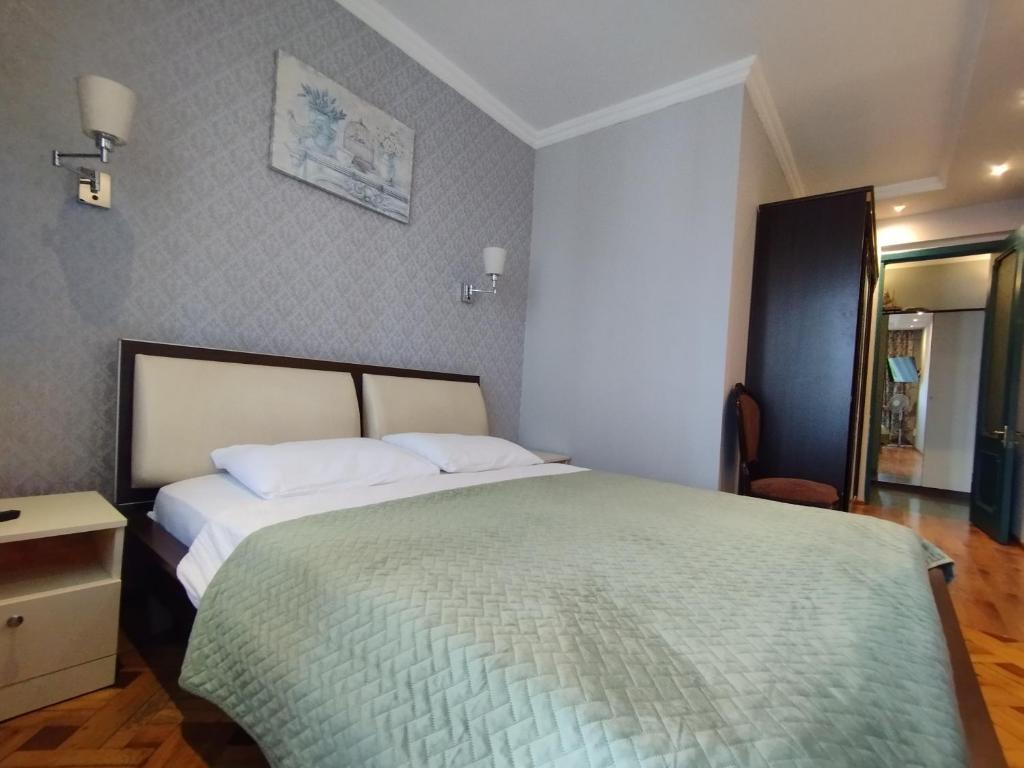 Postel nebo postele na pokoji v ubytování Davka Apartments
