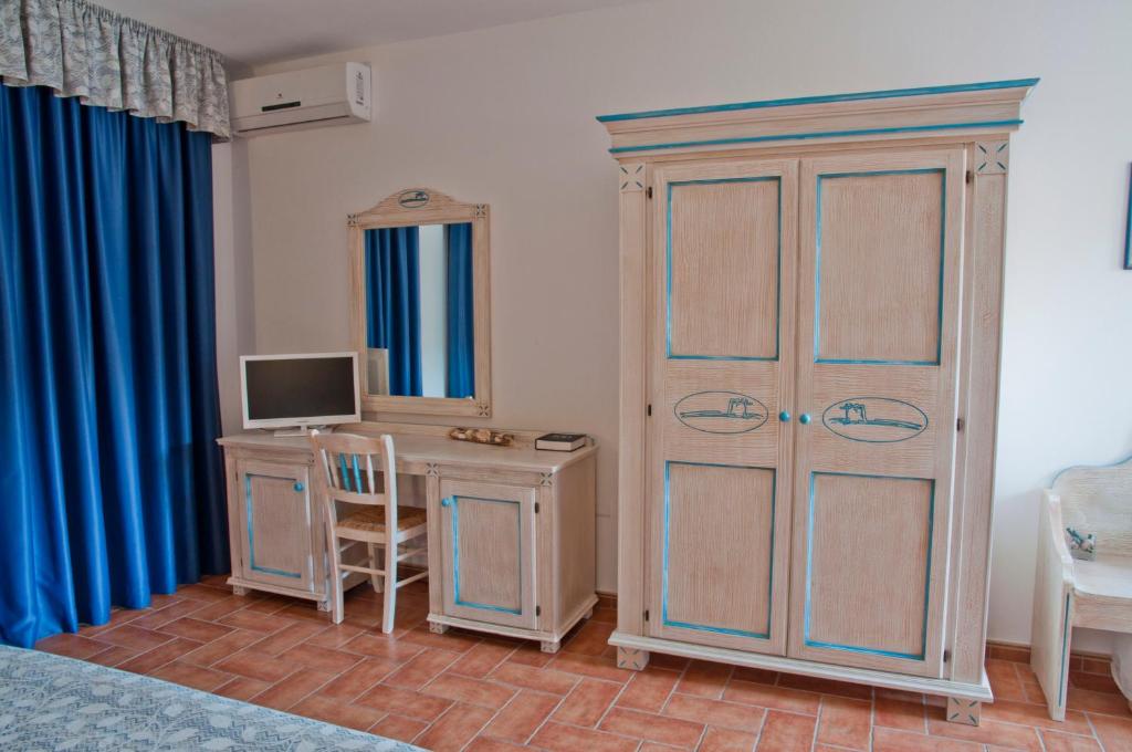 TV a/nebo společenská místnost v ubytování Hotel le Sabbie