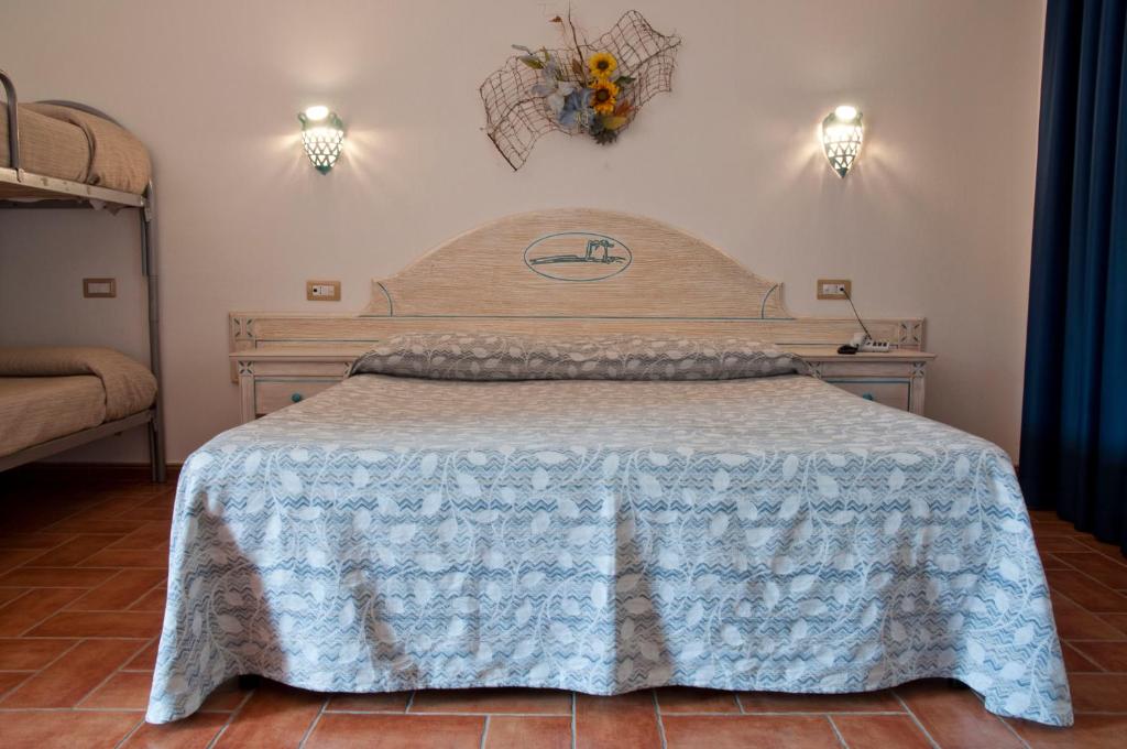 Postel nebo postele na pokoji v ubytování Hotel le Sabbie