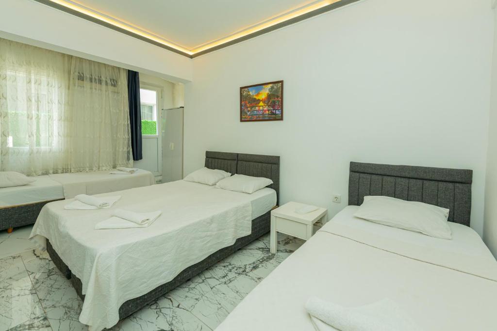 Postel nebo postele na pokoji v ubytování Aliş Hotel Fethiye