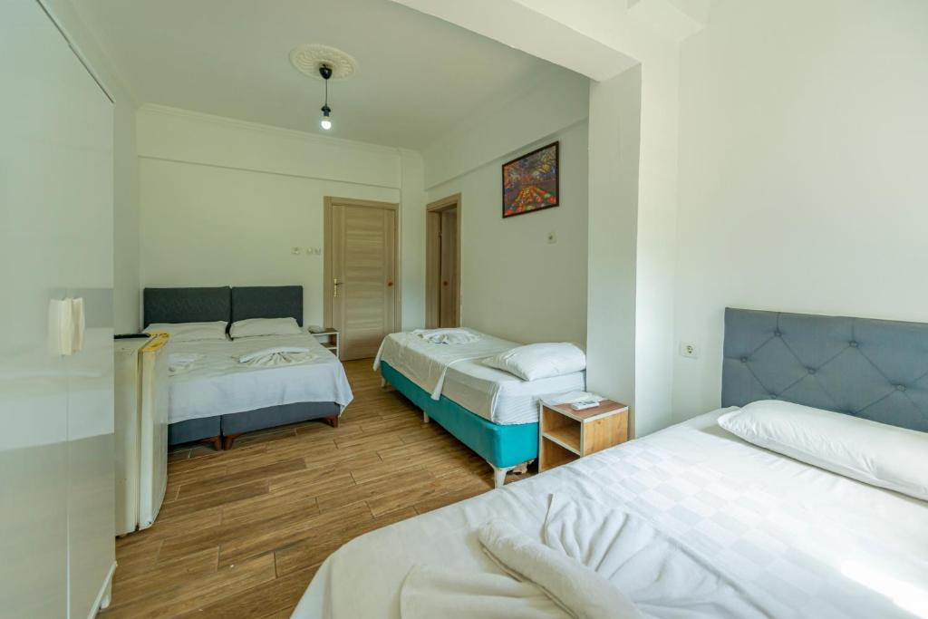 Postel nebo postele na pokoji v ubytování Aliş Hotel Fethiye