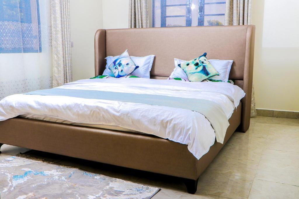 Ένα ή περισσότερα κρεβάτια σε δωμάτιο στο Haven Suites Bnb - Runogone