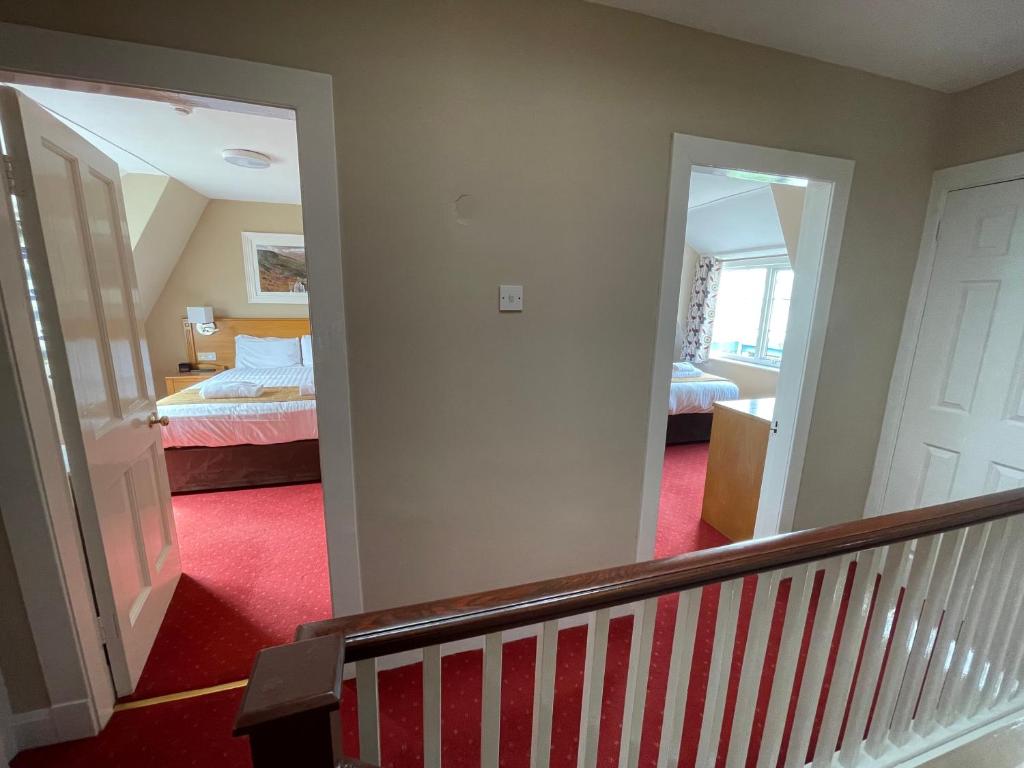 Postel nebo postele na pokoji v ubytování Belmore Court & Motel