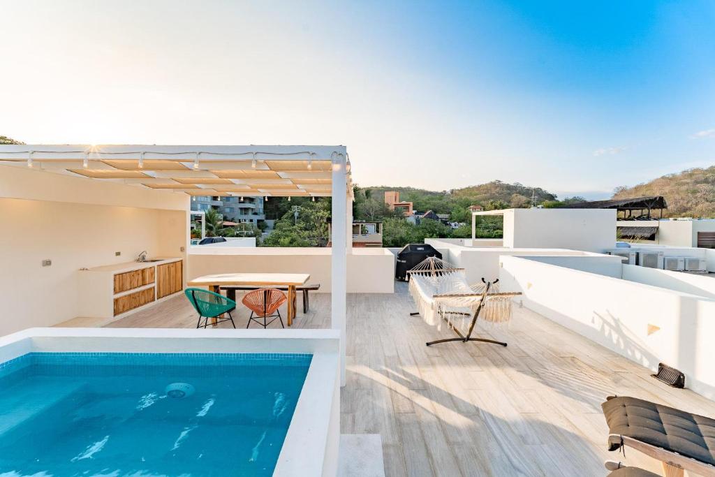 a pool on the roof of a house at 3060 - Bocana Beach Condo B2 in Valerio Martínez