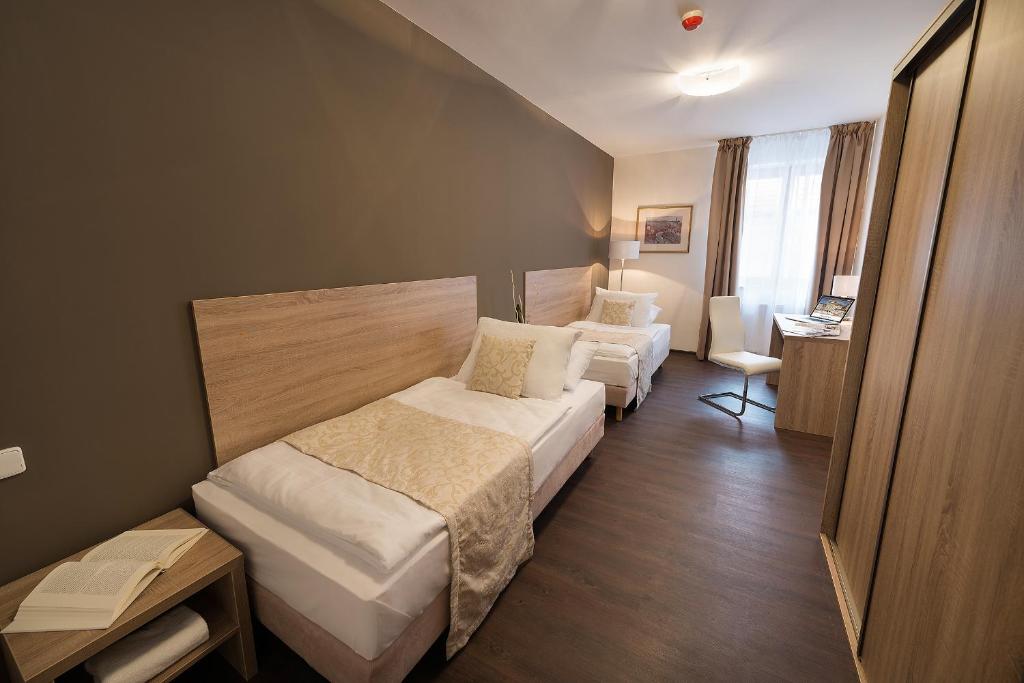 Voodi või voodid majutusasutuse Grandhotel Zvon toas