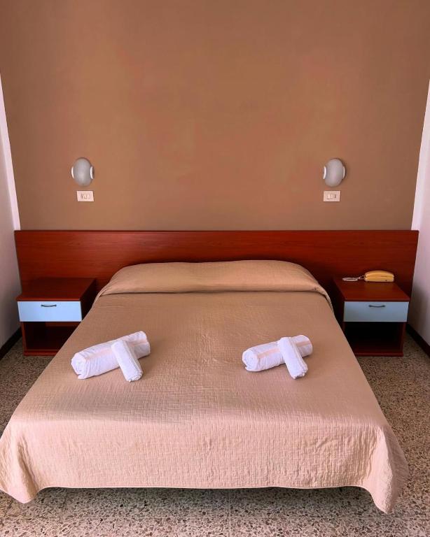 Postel nebo postele na pokoji v ubytování Hotel ROSE NUOVE
