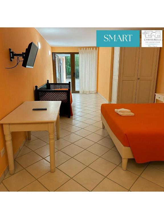 Postel nebo postele na pokoji v ubytování Chiusurelle Village Resort