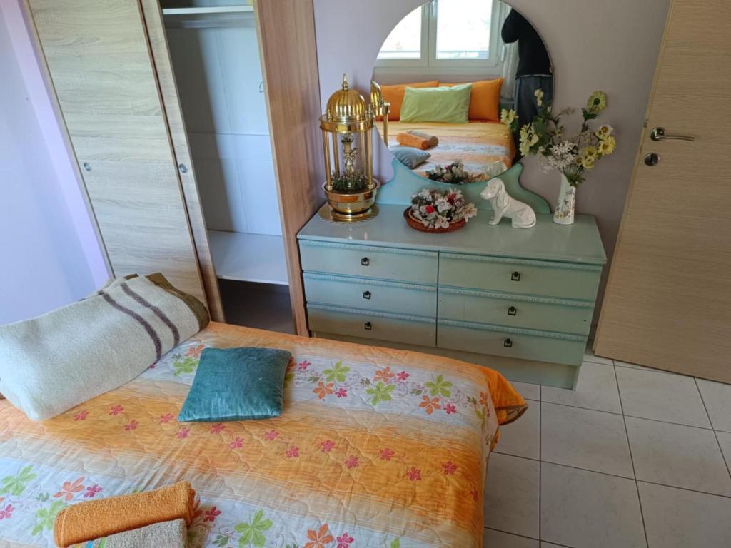 Postel nebo postele na pokoji v ubytování Dimis apartments