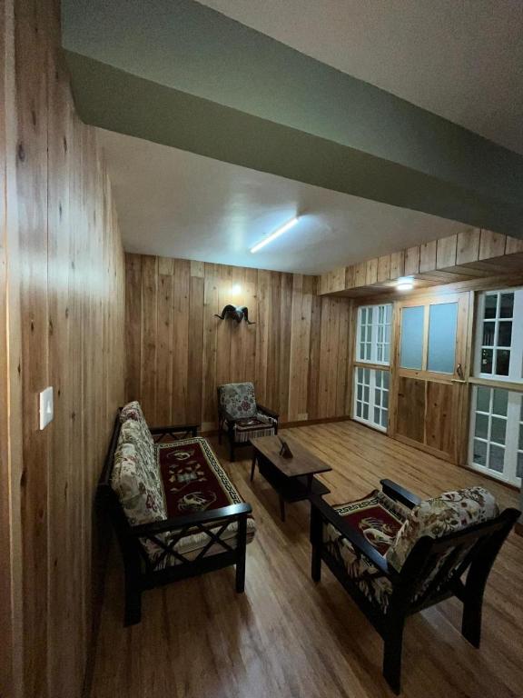 Posezení v ubytování Homyst Gangtok