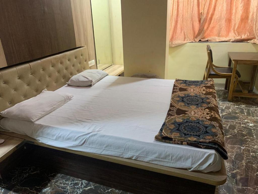 Voodi või voodid majutusasutuse Hotel Golden toas