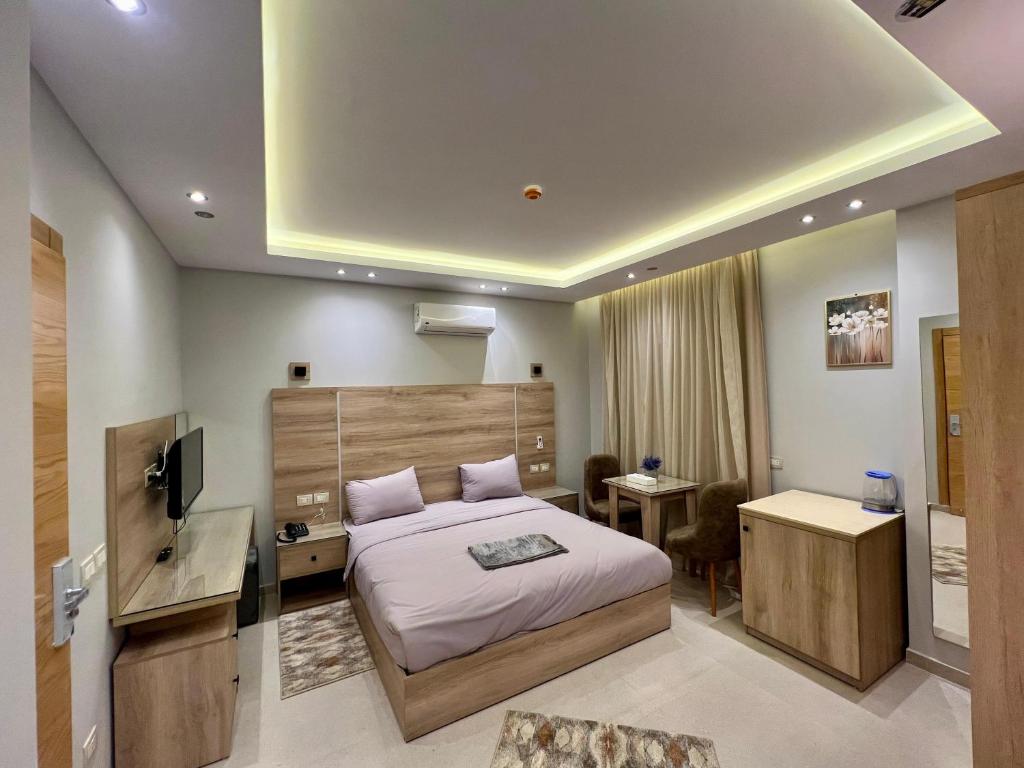 Giường trong phòng chung tại Elite hotel