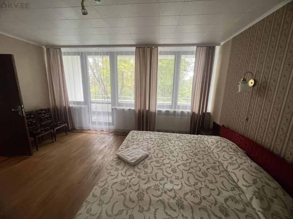 Postel nebo postele na pokoji v ubytování Narva-Jõesuu Beach Residence