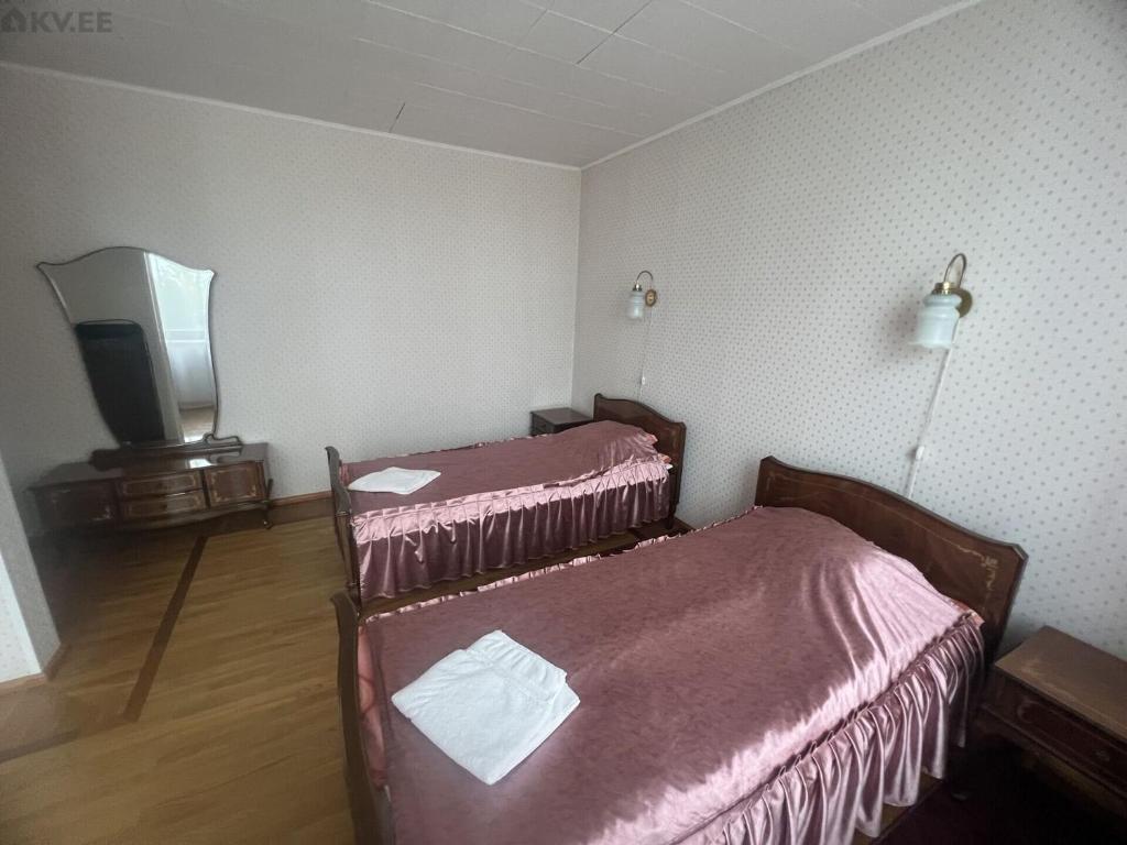 Postel nebo postele na pokoji v ubytování Narva-Jõesuu Beach Residence