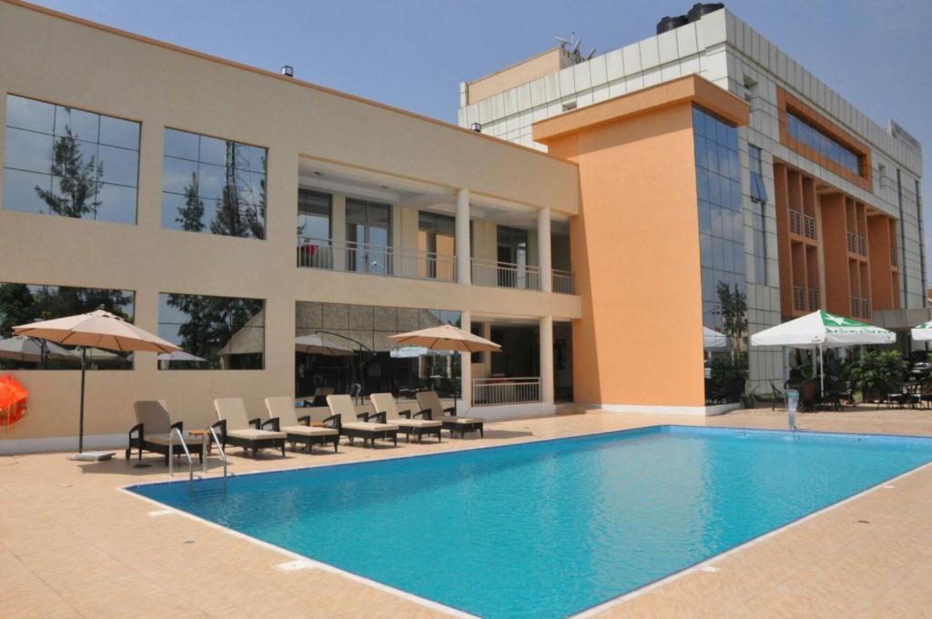 a swimming pool in front of a building at Great Seasons Hotel in Kigali