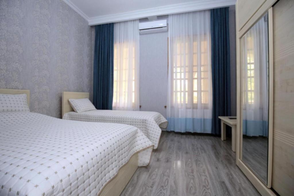 Postel nebo postele na pokoji v ubytování Medea Guest House