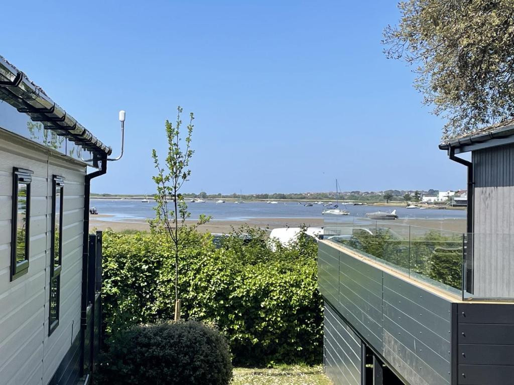 a view of the beach from the balcony of a house at The Jetty in Christchurch