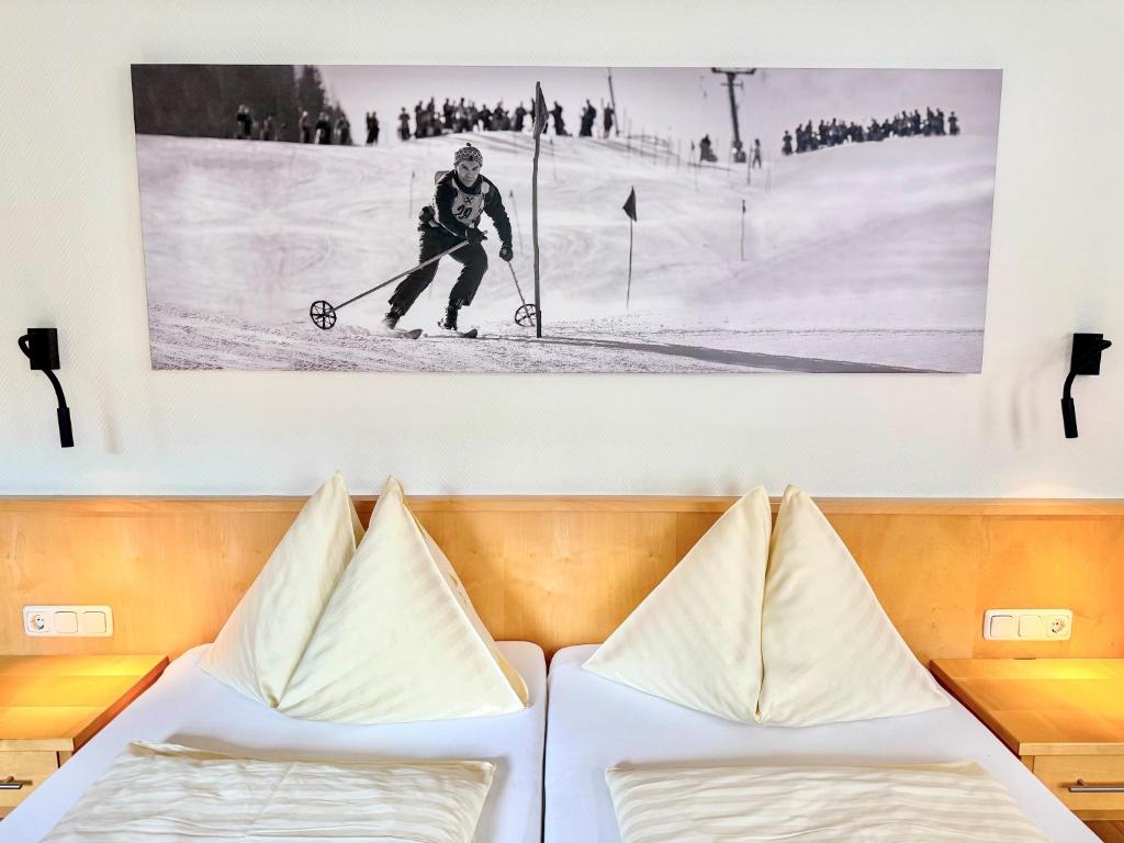 Postel nebo postele na pokoji v ubytování Mühlbacher - inklusive kostenfreiem Eintritt in die Alpentherme