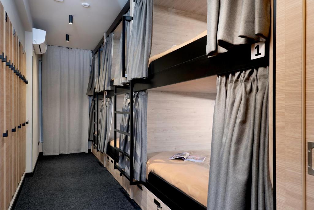 Postel nebo postele na pokoji v ubytování U-NIGHT Hostel