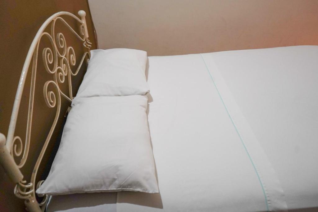 Postel nebo postele na pokoji v ubytování OYO Hotel El Conquistador
