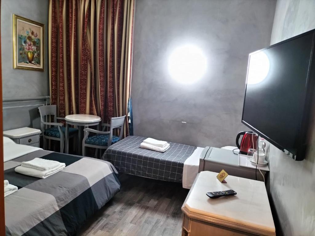 TV o dispositivi per l'intrattenimento presso Hotel Positano 2
