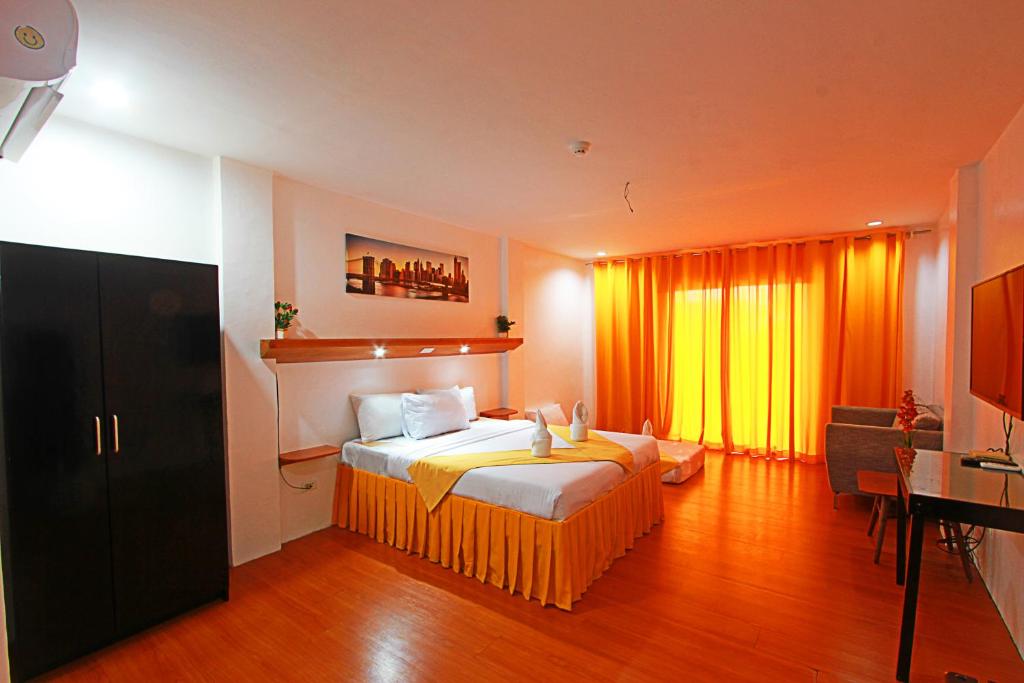 Postel nebo postele na pokoji v ubytování Harmony Hotel