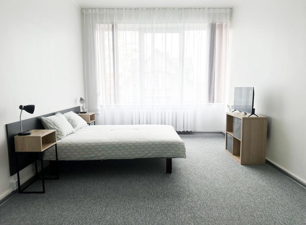 Postel nebo postele na pokoji v ubytování Kerese Beach House