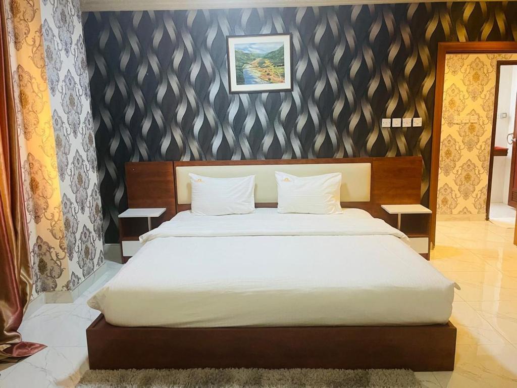 Postel nebo postele na pokoji v ubytování Grand Inn Hotel By Wanasa