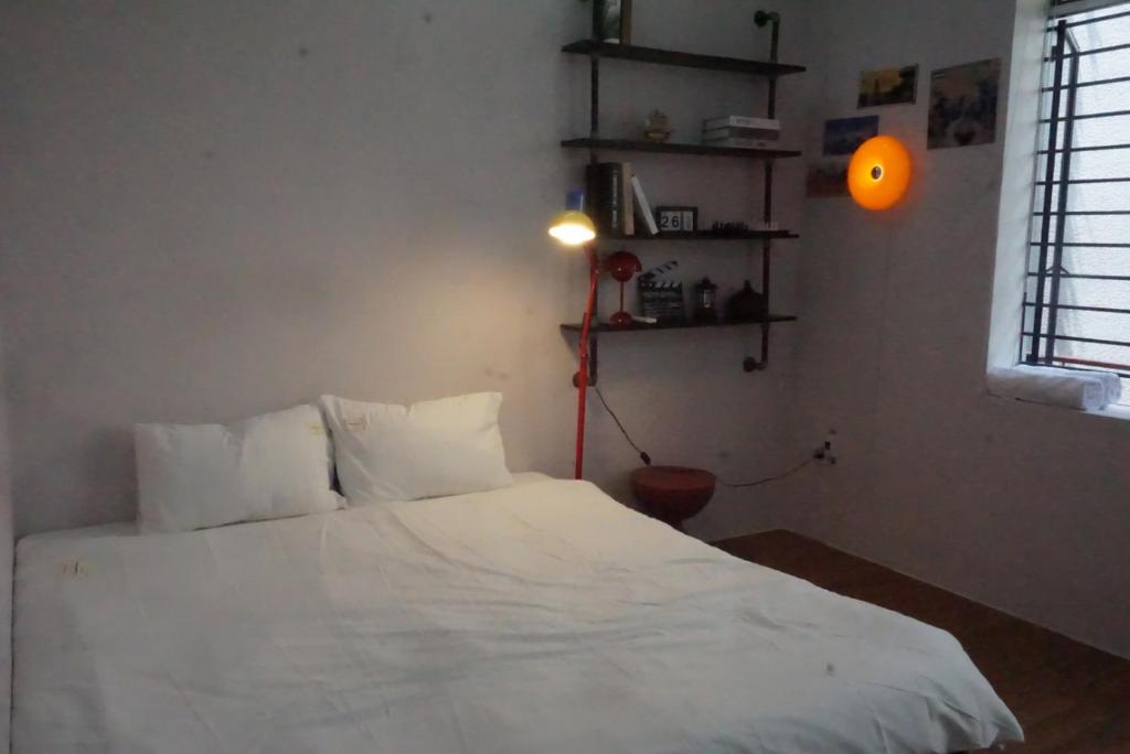 Postel nebo postele na pokoji v ubytování Mơ Màng Homestay